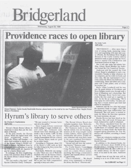 newspaper article titled Providence races to open a library.